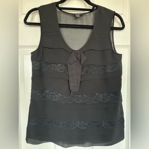 Sleeveless black top with lace detail